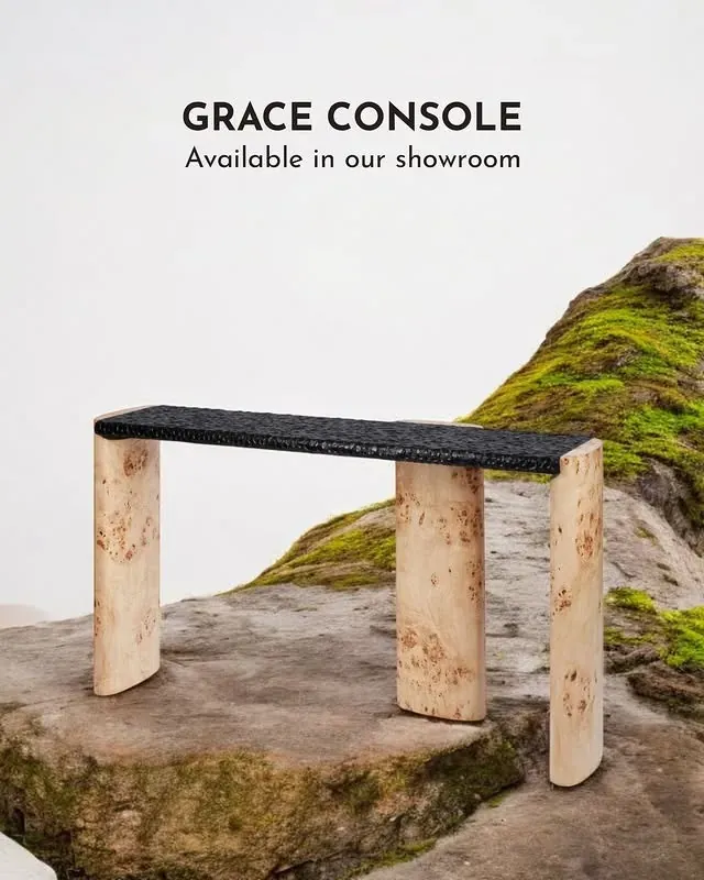 Okra ad: the Grace Console on a mossy rock, available in the showroom
